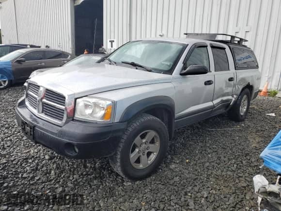 2006 Dodge Dakota SLT z VIN 1D7HW48N36S522858, wystawiony jako Copart lot #66431064 z przebiegiem 197 028 mil mil oraz Szkoda całkowita • Salvage title. Historia ofert i sprzedaży dostępna na DreamBid. Obrazek 1.
