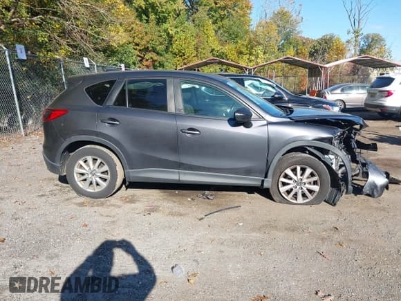 ✅ 2016 Mazda CX-5 Touring • VIN: JM3KE4CY5G0716056 • Lot: 43521281. Listed on IAAI with 107,968 mi. Free auction sales archive from the USA and detailed vehicle history report at DreamBid. Image 13.