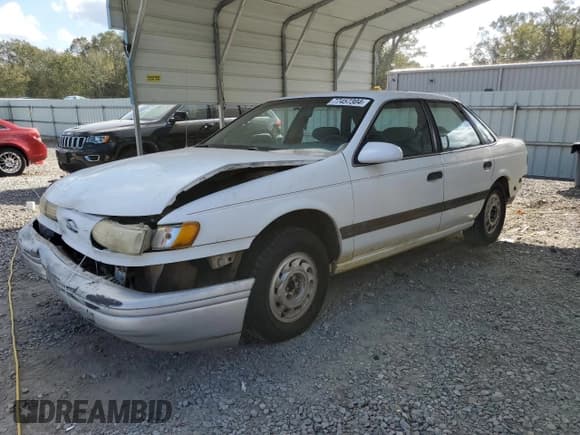 ✅ 1992 Ford Taurus GL • VIN: 1FALP52U5NA280821 • Lot: 77457304. Listed on Copart with 33,484 mi. Free auction sales archive from the USA and detailed vehicle history report at DreamBid. Image 1.