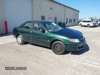 ✅ 2001 Mazda Protege LX • VIN: JM1BJ225310404647 • Lot: 41480466. Wystawiony na IAAI z przebiegiem 115 606 mil. Bezpłatny archiwum sprzedaży aukcyjnych z USA i szczegółowy raport historii pojazdu na DreamBid. Zdjęcie 1.