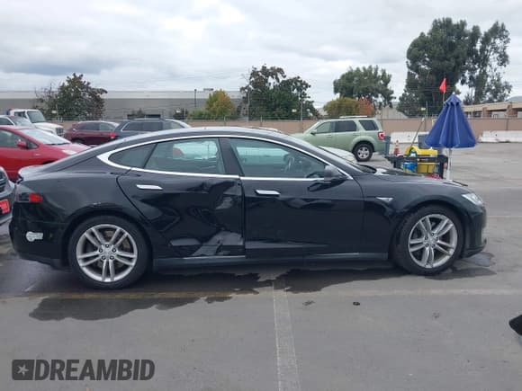 ✅ 2015 Tesla Model S 85 • VIN: 5YJSA1E16FF107254 • Lot: 43741109. Listed on IAAI with 119,933 mi. Free auction sales archive from the USA and detailed vehicle history report at DreamBid. Image 14.