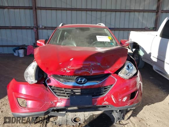 2010 Hyundai Tucson GLS with VIN KM8JUCAC8AU057801, listed as a IAAI auction lot 41037140 with 115,529 mi miles and . Bid and sale history available at DreamBid. Image 12.