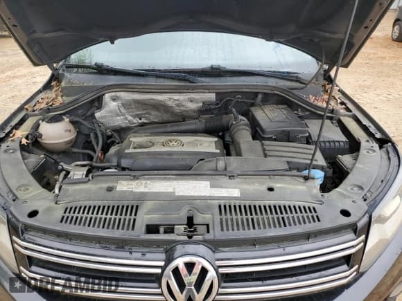 ✅ 2012 Volkswagen Tiguan LE • VIN: WVGAV7AX9CW555942 • Lot: 51303575. Listed on Copart with 130,491 mi. Free auction sales archive from the USA and detailed vehicle history report at DreamBid. Image 12.