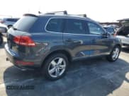 ✅ 2014 Volkswagen Touareg Exec • VIN: WVGEP9BP5ED014956 • Lot: 66539905. Listed on Copart with 156,700 mi. Free auction sales archive from the USA and detailed vehicle history report at DreamBid. Image 3.