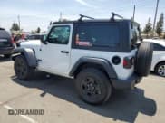 ✅ 2025 Jeep Wrangler Sport • VIN: 1C4PJXAN2SW576316 • Lot: 60550635. Listed on Copart with 1,730 mi. Free auction sales archive from the USA and detailed vehicle history report at DreamBid. Image 2.