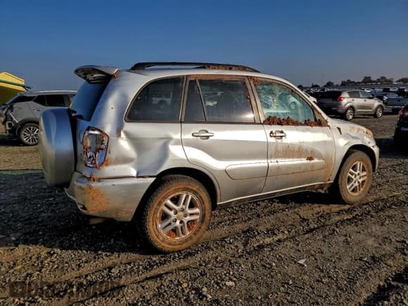 ✅ 2003 Toyota RAV4 • VIN: JTEGH20V830107215 • Лот: 94493765. Опубликован ранее на Copart с пробегом 252 429 миль. Бесплатный доступ к архиву аукционных продаж из США и подробный отчёт об истории автомобиля на DreamBid. Изображение 3.