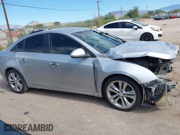 2013 Chevrolet Cruze LTZ z VIN 1G1PG5SBXD7201836, wystawiony jako IAAI lot #43507702 z przebiegiem Nie podano mil oraz . Historia ofert i sprzedaży dostępna na DreamBid. Obrazek 13.