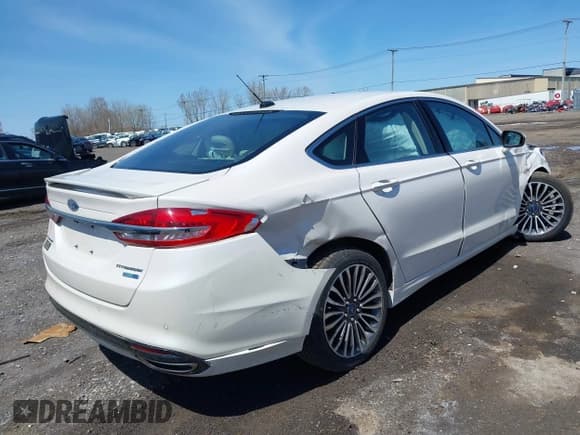 ✅ 2018 Ford Fusion Titanium • VIN: 3FA6P0D95JR154967 • Lot: 42133178. Listed on IAAI with 65,219 mi. Free auction sales archive from the USA and detailed vehicle history report at DreamBid. Image 4.