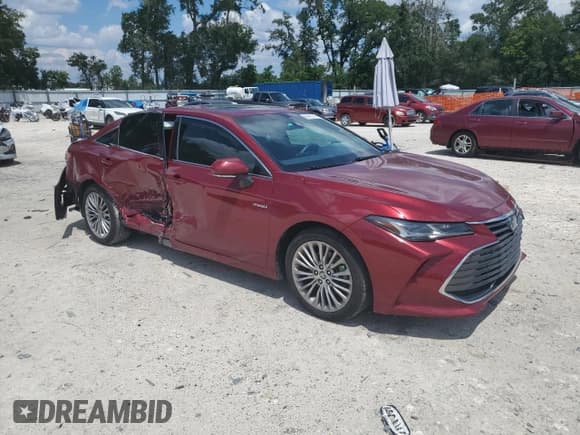 ✅ 2020 Toyota Avalon Limited Hybrid • VIN: 4T1D21FB5LU018528 • Lot: 69410745. Listed on Copart with 99,828 mi. Free auction sales archive from the USA and detailed vehicle history report at DreamBid. Image 4.