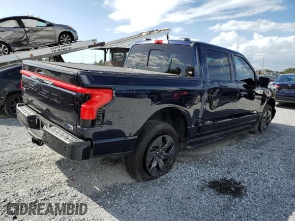 ✅ 2023 Ford F-150 Lightning Lariat • VIN: 1FTVW1EL7PWG20719 • Lot: 85266825. Listed on Copart with 66,237 mi. Free auction sales archive from the USA and detailed vehicle history report at DreamBid. Image 3.