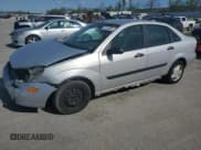 ✅ 2003 Ford Focus LX • VIN: 1FAFP33P23W311601 • Lot: 66027835. Wystawiony na Copart z przebiegiem 216 193 mil. Bezpłatny archiwum sprzedaży aukcyjnych z USA i szczegółowy raport historii pojazdu na DreamBid. Zdjęcie 1.