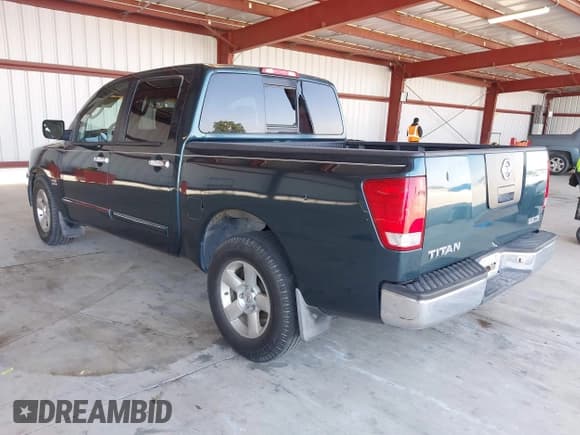 ✅ 2004 Nissan Titan XE • VIN: 1N6AA07A14N582728 • Lot: 42032653. Listed on IAAI with 117,601 mi. Free auction sales archive from the USA and detailed vehicle history report at DreamBid. Image 3.