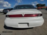 ✅ 1997 Lincoln Mark VIII • VIN: 1LNLM91V5VY659180 • Lot: 74809954. Listed on Copart with 121,085 mi. Free auction sales archive from the USA and detailed vehicle history report at DreamBid. Image 6.