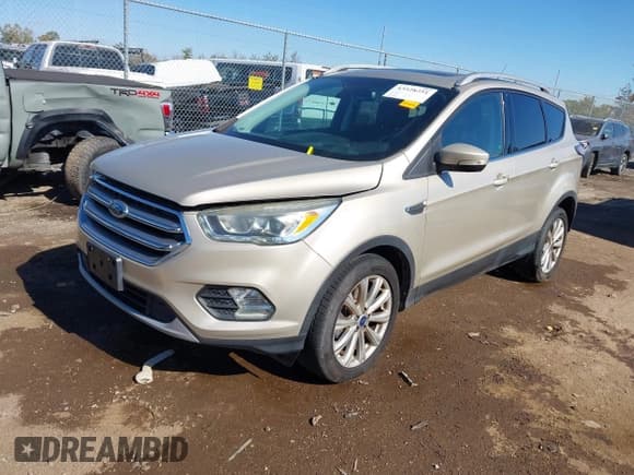 ✅ 2017 Ford Escape Titanium • VIN: 1FMCU9J95HUD82688 • Лот: 43528251. Опубликован ранее на IAAI с пробегом 82 076 миль. Бесплатный доступ к архиву аукционных продаж из США и подробный отчёт об истории автомобиля на DreamBid. Изображение 2.