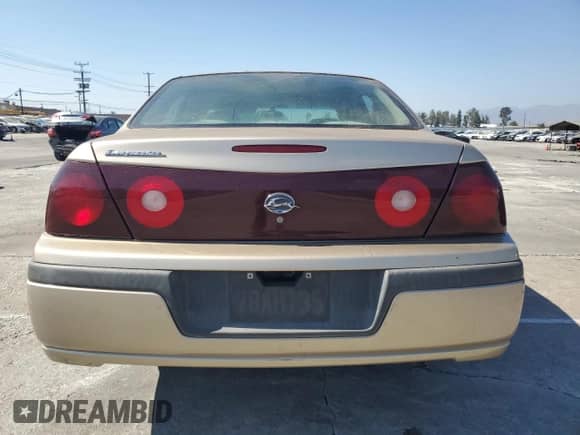 2004 Chevrolet Impala with VIN 2G1WF52E949127977, listed as a Copart auction lot 71259914 with 103,782 mi miles and Salvage title. Bid and sale history available at DreamBid. Image 6.