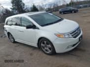 ✅ 2012 Honda Odyssey Touring • VIN: 5FNRL5H9XCB126080 • Lot: 43686755. Listed on IAAI with 116,383 mi. Free auction sales archive from the USA and detailed vehicle history report at DreamBid. Image 1.