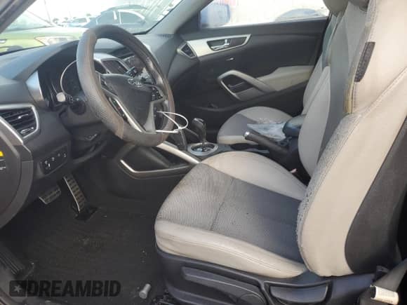 2013 Hyundai Veloster w/Gray Int с VIN KMHTC6ADXDU098117, выставлен на аукционе Copart как лот 74143514 с пробегом Не указан миль и Списание • Salvage title. История ставок и продаж доступна на DreamBid. Изображение 7.