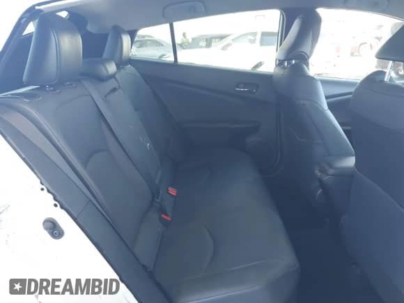 2021 Toyota Prius L Eco with VIN JTDKAMFU4M3134943, listed as a IAAI auction lot 43175713 with 106,611 mi miles and . Bid and sale history available at DreamBid. Image 8.