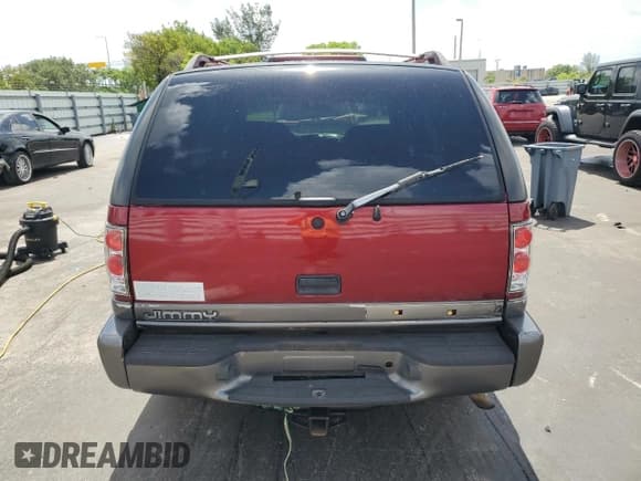 ✅ 2000 GMC Jimmy SLE • VIN: 1GKCS13WXY2357087 • Лот: 60999105. Опубликован ранее на Copart с пробегом 90 017 миль. Бесплатный доступ к архиву аукционных продаж из США и подробный отчёт об истории автомобиля на DreamBid. Изображение 6.