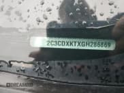 ✅ 2016 Dodge Charger Police • VIN: 2C3CDXKTXGH286869 • Lot: 58623795. Listed on Copart with 69,570 mi. Free auction sales archive from the USA and detailed vehicle history report at DreamBid. Image 12.