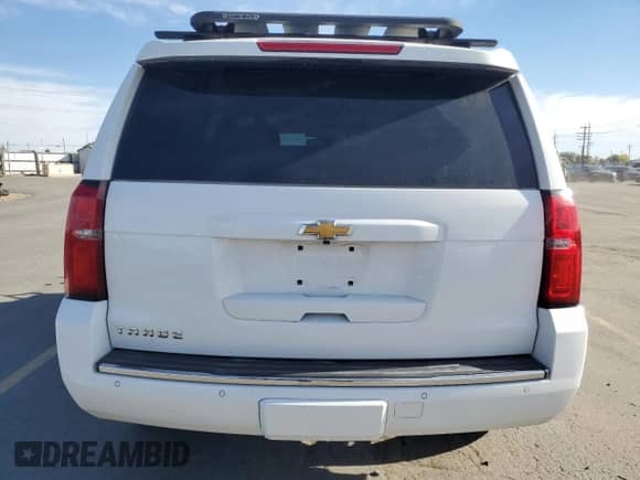 2015 Chevrolet Tahoe LTZ with VIN 1GNSKCKC1FR118128, listed as a Copart auction lot 89589135 with 129,932 mi miles and Salvage title. Bid and sale history available at DreamBid. Image 6.