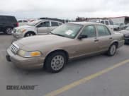 ✅ 2005 Ford Crown Victoria Standard • VIN: 2FAFP73W65X114422 • Lot: 41301890. Listed on IAAI with 209,199 mi. Free auction sales archive from the USA and detailed vehicle history report at DreamBid. Image 2.