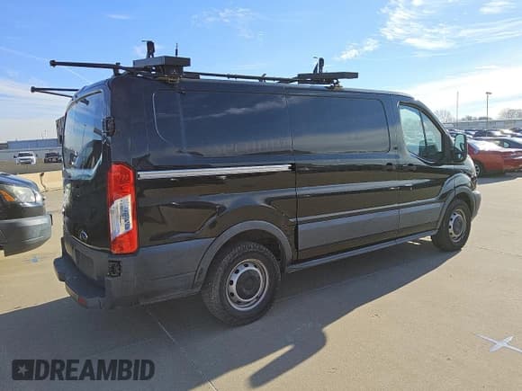 ✅ 2015 Ford Transit Cargo • VIN: 1FTYE1YM2FKA21561 • Лот: 86949274. Опубликован ранее на Copart с пробегом 160 535 миль. Бесплатный доступ к архиву аукционных продаж из США и подробный отчёт об истории автомобиля на DreamBid. Изображение 3.