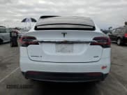 ✅ 2017 Tesla Model X 90D • VIN: 5YJXCBE29HF041283 • Lot: 69864222. Listed on Copart with 51,218 mi. Free auction sales archive from the USA and detailed vehicle history report at DreamBid. Image 6.