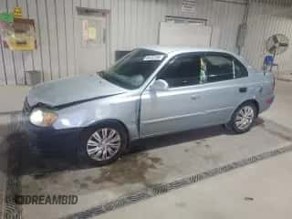 2005 Hyundai Accent GLS z VIN KMHCG45C65U662633, wystawiony jako Copart lot #86432595 z przebiegiem 221 608 mil mil oraz Szkoda całkowita • Salvage title. Historia ofert i sprzedaży dostępna na DreamBid. Obrazek 1.