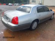 ✅ 2004 Lincoln Town Car Signature • VIN: 1LNHM81WX4Y662048 • Lot: 43306938. Listed on IAAI with 143,979 mi. Free auction sales archive from the USA and detailed vehicle history report at DreamBid. Image 4.