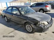 ✅ 2000 Mazda Protege DX • VIN: JM1BJ2220Y0239835 • Lot: 80228864. Wystawiony na Copart z przebiegiem 200 936 mil. Bezpłatny archiwum sprzedaży aukcyjnych z USA i szczegółowy raport historii pojazdu na DreamBid. Zdjęcie 4.