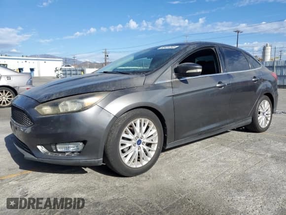 ✅ 2015 Ford Focus Titanium • VIN: 1FADP3J24FL387048 • Lot: 82431245. Listed on Copart with 124,984 mi. Free auction sales archive from the USA and detailed vehicle history report at DreamBid. Image 1.
