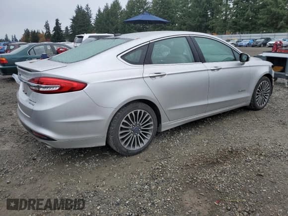 ✅ 2017 Ford Fusion Hybrid Titanium • VIN: 3FA6P0RU2HR287581 • Lot: 82467875. Listed on Copart with 69,229 mi. Free auction sales archive from the USA and detailed vehicle history report at DreamBid. Image 3.