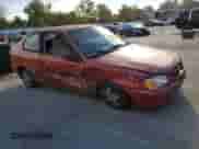 2000 Hyundai Accent with VIN KMHCG35G7YU033965, listed as a Copart auction lot 82433065 with 111,729 mi miles and Salvage title. Bid and sale history available at DreamBid. Image 4.