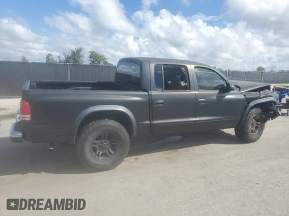 2002 Dodge Dakota SLT z VIN 1B7HL48X12S560488, wystawiony jako Copart lot #81853665 z przebiegiem 143 442 mil mil oraz Szkoda całkowita • Salvage title. Historia ofert i sprzedaży dostępna na DreamBid. Obrazek 3.