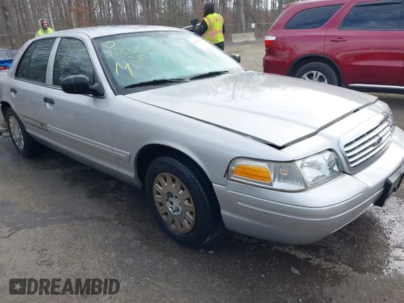 ✅ 2005 Ford Crown Victoria Standard • VIN: 2FAFP73W25X117107 • Lot: 41838842. Listed on IAAI with 224,720 mi. Free auction sales archive from the USA and detailed vehicle history report at DreamBid. Image 1.