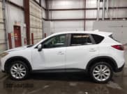 ✅ 2013 Mazda CX-5 Grand Touring • VIN: JM3KE4DE4D0154618 • Lot: 42784734. Wystawiony na IAAI z przebiegiem 127 887 mil. Bezpłatny archiwum sprzedaży aukcyjnych z USA i szczegółowy raport historii pojazdu na DreamBid. Zdjęcie 15.