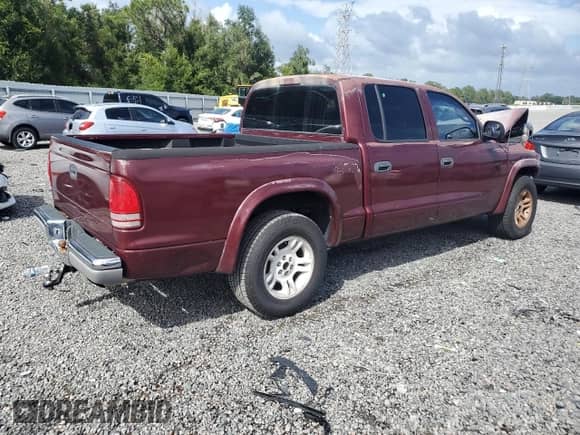 2002 Dodge Dakota SLT z VIN 1B7HL48X62S662174, wystawiony jako Copart lot #84585345 z przebiegiem 213 924 mil mil oraz Szkoda całkowita • Salvage title. Historia ofert i sprzedaży dostępna na DreamBid. Obrazek 3.