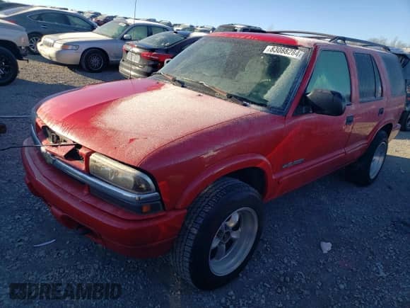 2002 Chevrolet Blazer LS z VIN 1GNDT13W12K144430, wystawiony jako Copart lot #83088284 z przebiegiem 176 393 mil mil oraz Szkoda całkowita • Salvage title. Historia ofert i sprzedaży dostępna na DreamBid. Obrazek 1.