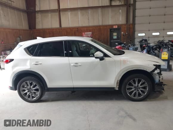 ✅ 2020 Mazda CX-5 Grand Touring • VIN: JM3KFBDMXL0868986 • Лот: 43154043. Опубликован ранее на IAAI с пробегом 56 480 миль. Бесплатный доступ к архиву аукционных продаж из США и подробный отчёт об истории автомобиля на DreamBid. Изображение 13.