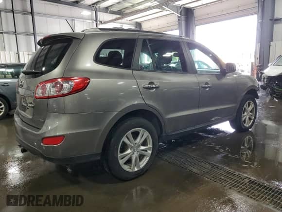 2012 Hyundai Santa Fe Limited с VIN 5XYZKDAGXCG152385, выставлен на аукционе Copart как лот 63775244 с пробегом 149 243 миль миль и Списание • Salvage title. История ставок и продаж доступна на DreamBid. Изображение 3.