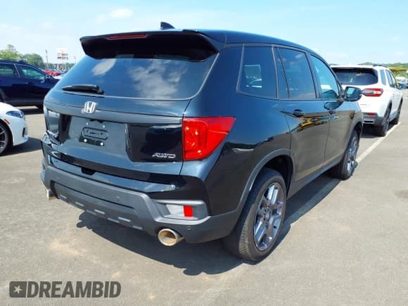 ✅ 2023 Honda Passport EX-L • VIN: 5FNYF8H51PB009494 • Lot: 42751895. Listed on IAAI with 24,085 mi. Free auction sales archive from the USA and detailed vehicle history report at DreamBid. Image 4.