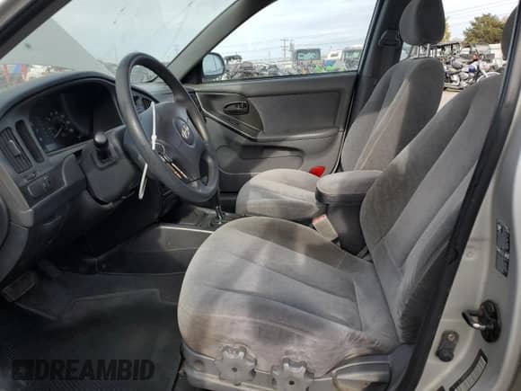 2005 Hyundai Elantra GLS z VIN KMHDN46D75U115937, wystawiony jako Copart lot #77410514 z przebiegiem 128 015 mil mil oraz Szkoda całkowita • Salvage title. Historia ofert i sprzedaży dostępna na DreamBid. Obrazek 7.