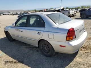 2003 Hyundai Accent GL z VIN KMHCG45CX3U474856, wystawiony jako Copart lot #67615445 z przebiegiem 205 400 mil mil oraz Szkoda całkowita • Salvage title. Historia ofert i sprzedaży dostępna na DreamBid. Obrazek 2.