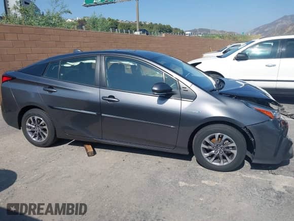 2021 Toyota Prius L Eco with VIN JTDKAMFU4M3144985, listed as a IAAI auction lot 42443957 with 20,816 mi miles and . Bid and sale history available at DreamBid. Image 13.