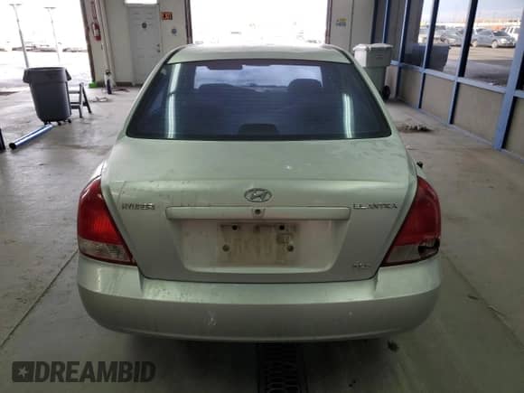 2001 Hyundai Elantra GLS z VIN KMHDN45D61U069948, wystawiony jako Copart lot #69787253 z przebiegiem 251 000 mil mil oraz Szkoda całkowita • Salvage title. Historia ofert i sprzedaży dostępna na DreamBid. Obrazek 6.