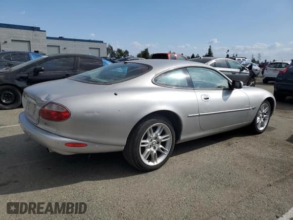 ✅ 2001 Jaguar XK • VIN: SAJDA41C01NA21437 • Lot: 78458894. Listed on Copart with 61,197 mi. Free auction sales archive from the USA and detailed vehicle history report at DreamBid. Image 3.