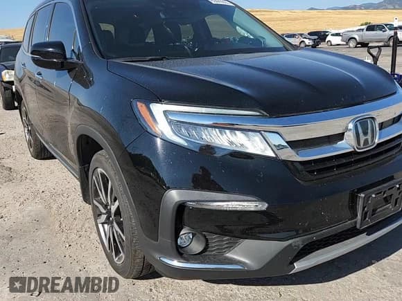 ✅ 2020 Honda Pilot Elite • VIN: 5FNYF6H07LB059545 • Lot: 69449805. Wystawiony na Copart z przebiegiem 73 388 mil. Bezpłatny archiwum sprzedaży aukcyjnych z USA i szczegółowy raport historii pojazdu na DreamBid. Zdjęcie 14.