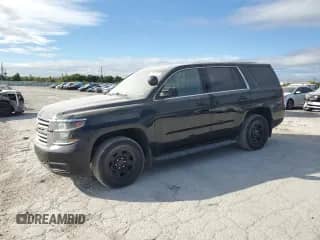 2019 Chevrolet Tahoe Commercial with VIN 1GNSKDEC0KR398281, listed as a Copart auction lot 84631075 with 77,186 mi miles and Clean title. Bid and sale history available at DreamBid. Image 1.
