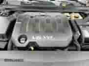 2017 Chevrolet Impala LT z VIN 2G1105S38H9185689, wystawiony jako Copart lot #86317055 z przebiegiem 128 364 mil mil oraz Szkoda całkowita • Salvage title. Historia ofert i sprzedaży dostępna na DreamBid. Obrazek 13.